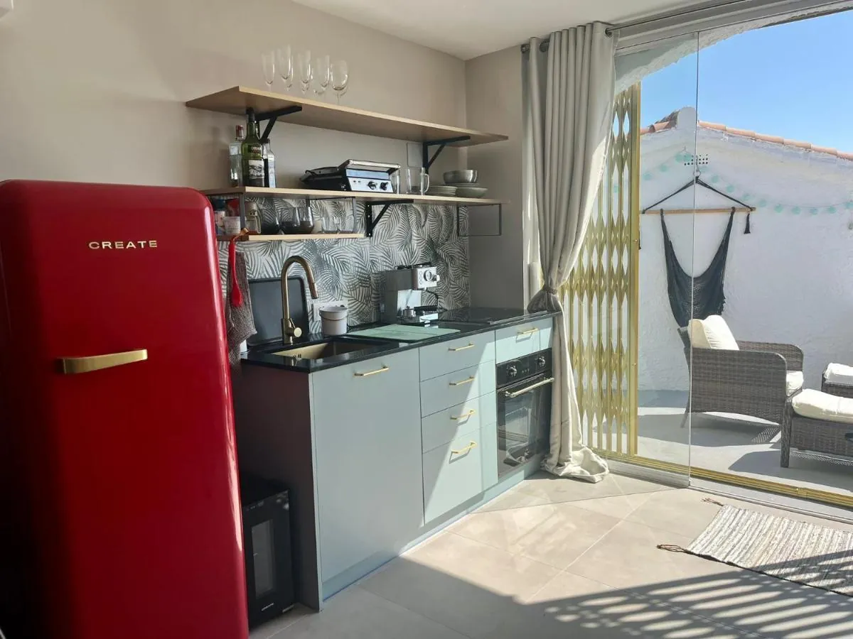 Kitchen with red fridge